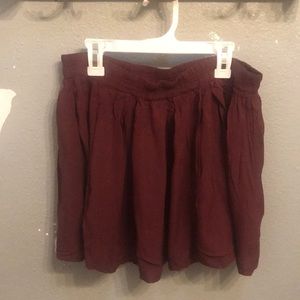 a maroon skirt